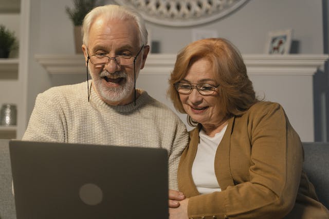 Elderly couple on a laptop looking at mortgages